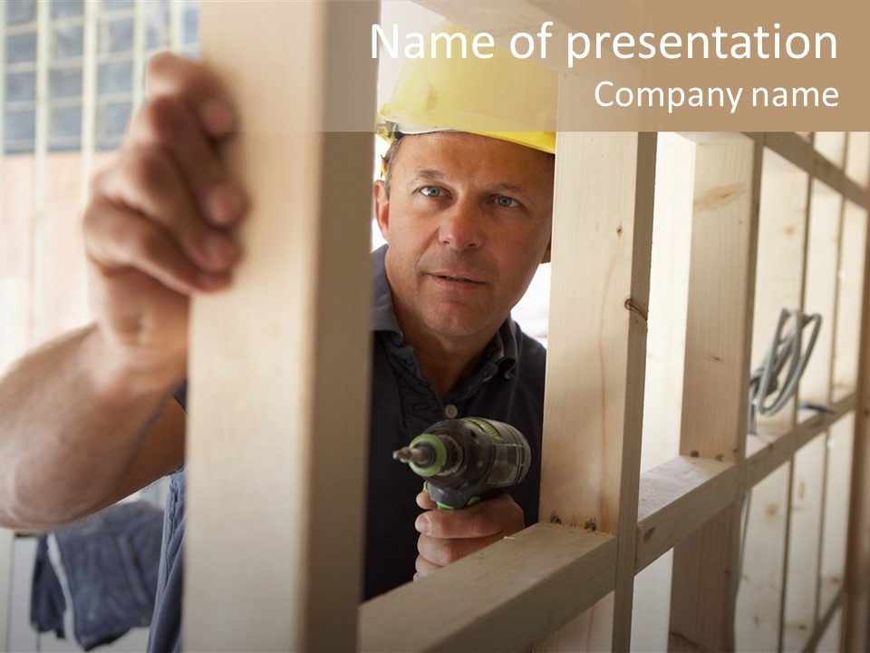 A Man In A Hard Hat Holding A Drill PowerPoint Template