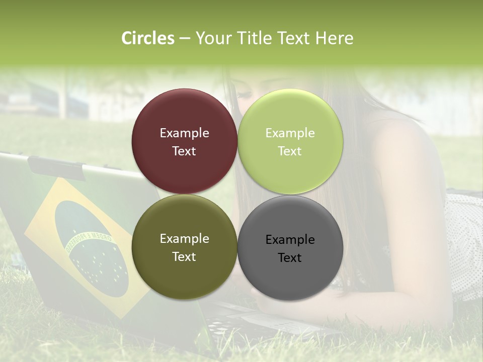 A Woman Laying On The Grass Using A Laptop Computer PowerPoint Template