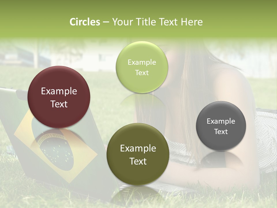 A Woman Laying On The Grass Using A Laptop Computer PowerPoint Template