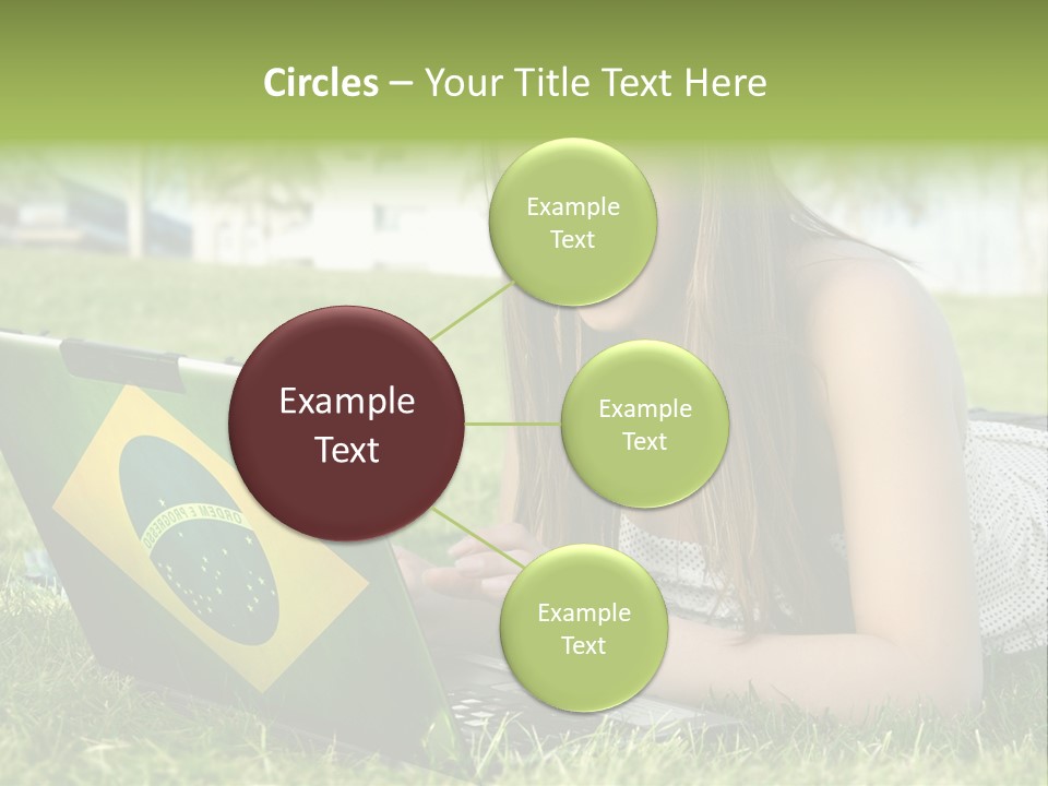 A Woman Laying On The Grass Using A Laptop Computer PowerPoint Template