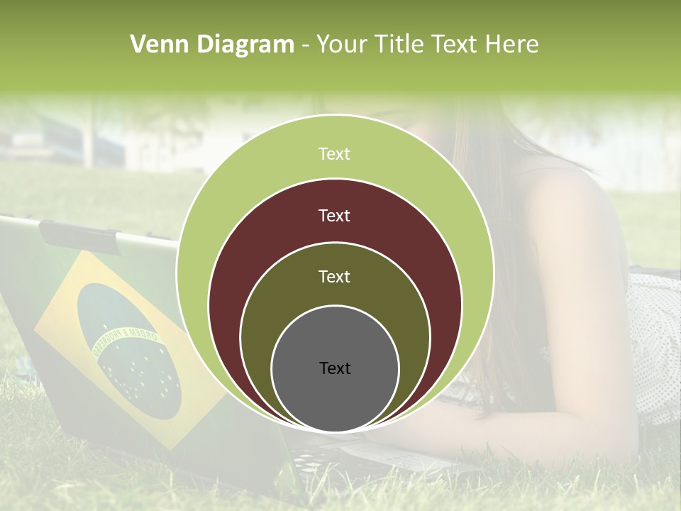A Woman Laying On The Grass Using A Laptop Computer PowerPoint Template
