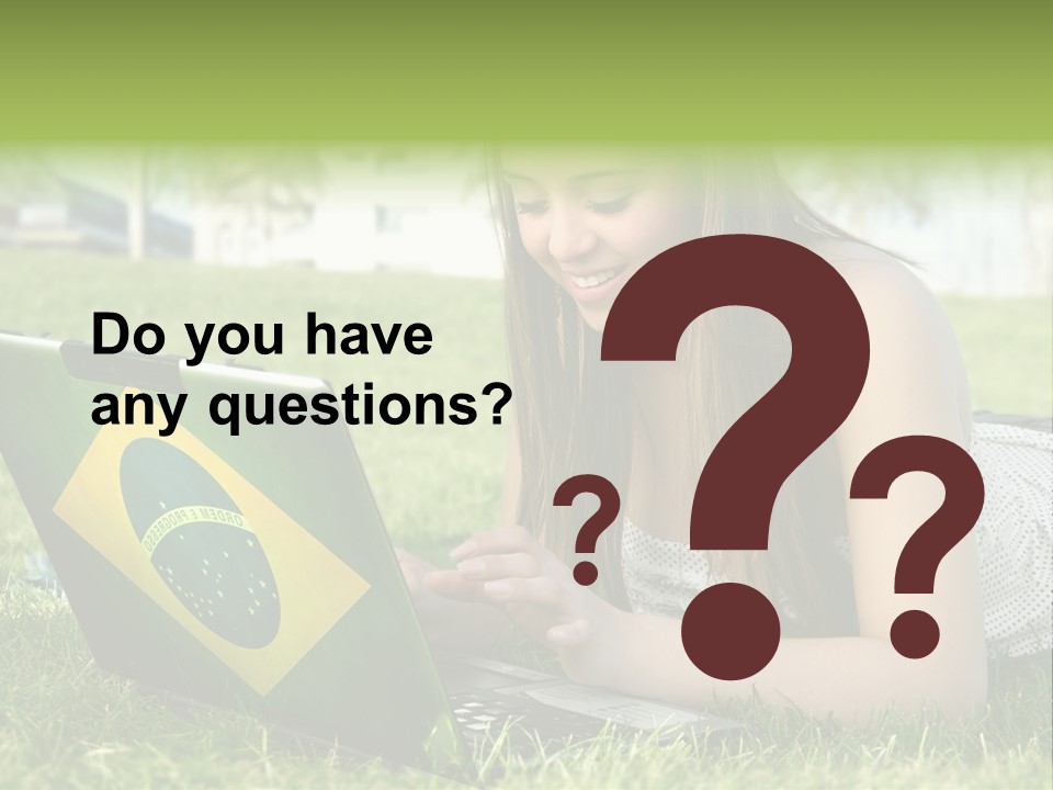 A Woman Laying On The Grass Using A Laptop Computer PowerPoint Template