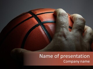 A Person Holding A Basketball In Their Hand PowerPoint Template
