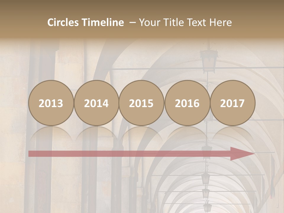 A Long Hallway With A Row Of Lamps Hanging From The Ceiling PowerPoint Template