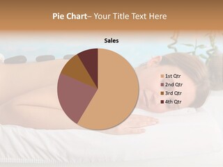 A Woman Laying Down In A Spa With Hot Stones On Her Back PowerPoint Template