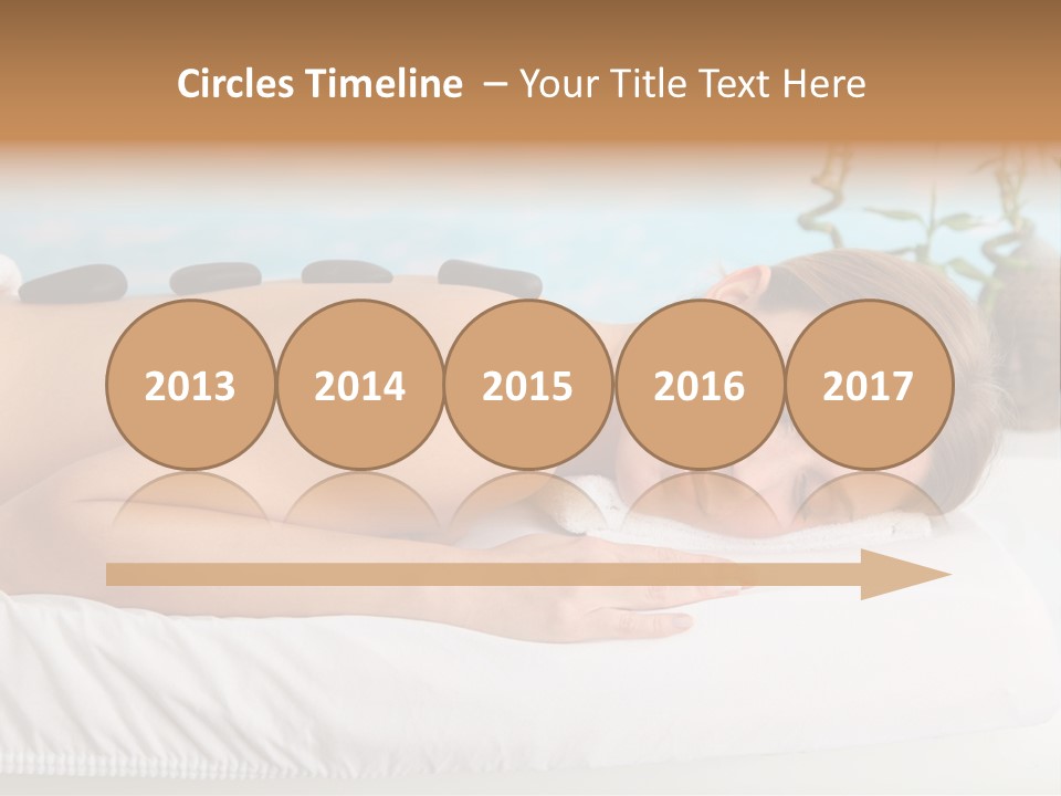 A Woman Laying Down In A Spa With Hot Stones On Her Back PowerPoint Template