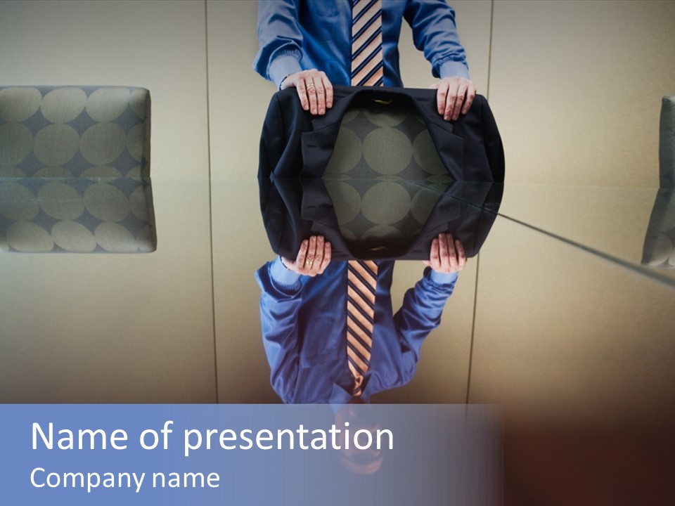 A Man In A Tie Is Holding A Black Hat PowerPoint Template