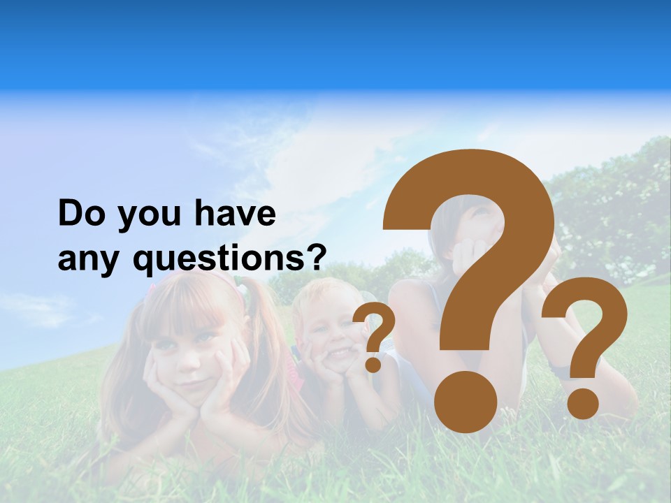 A Group Of Children Laying In The Grass PowerPoint Template