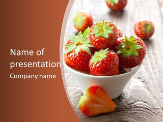 A Bowl Of Strawberries On A Wooden Table PowerPoint Template