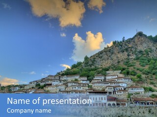 A Picture Of A Town On Top Of A Hill PowerPoint Template