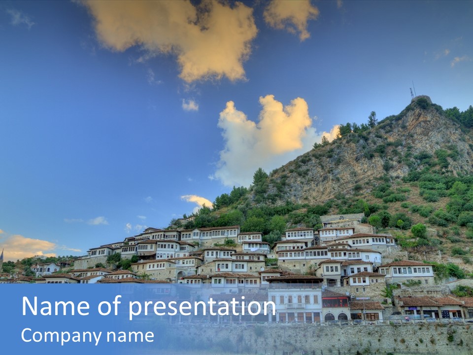 A Picture Of A Town On Top Of A Hill PowerPoint Template