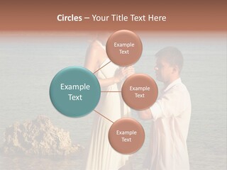 A Man And Woman Standing On A Beach Holding Hands PowerPoint Template
