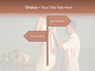 A Man And Woman Standing On A Beach Holding Hands PowerPoint Template