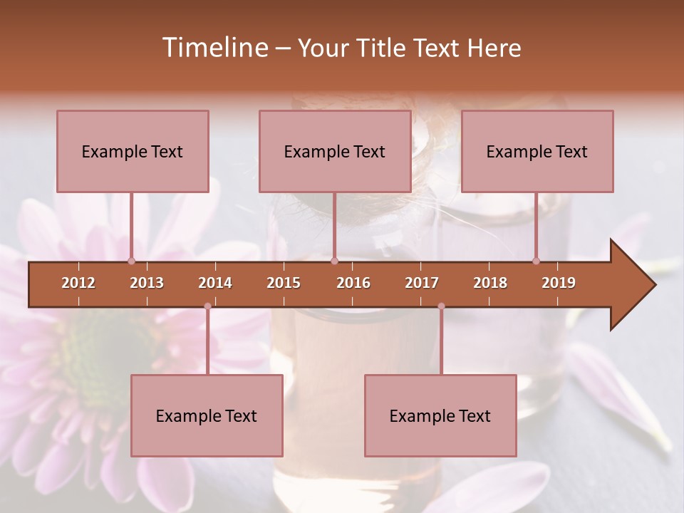 A Bottle Of Oil And A Flower On A Table PowerPoint Template