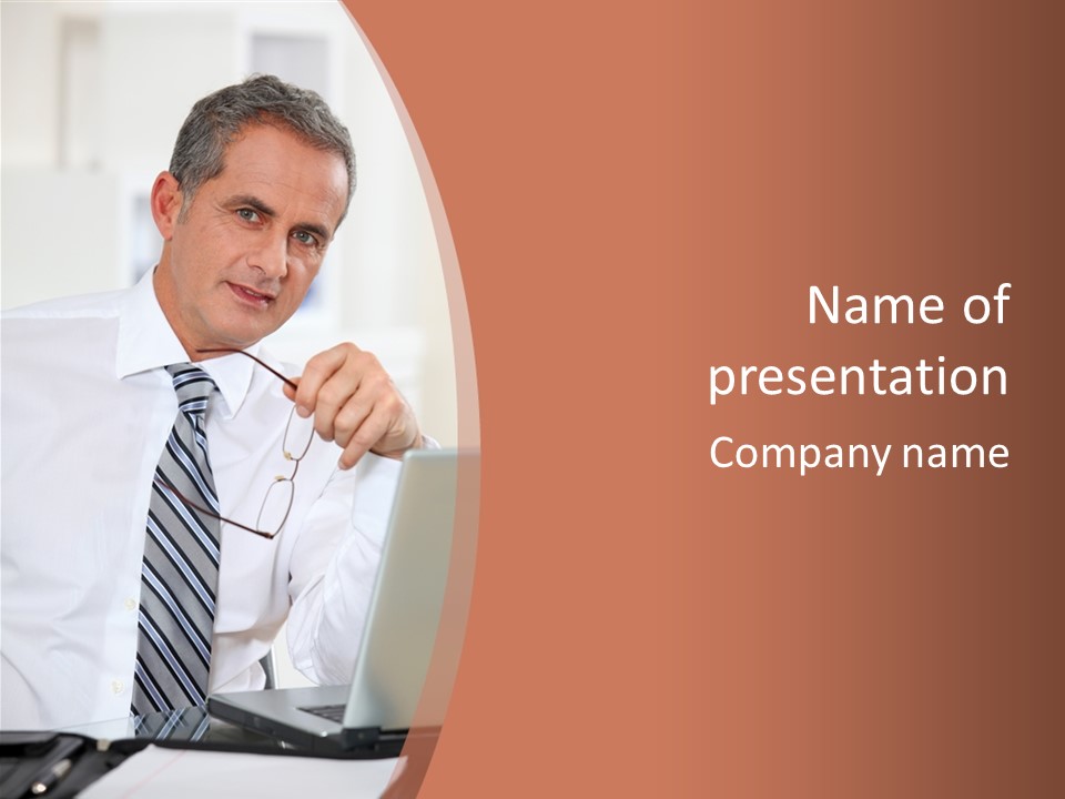 A Man In A Tie Is Looking At A Laptop PowerPoint Template