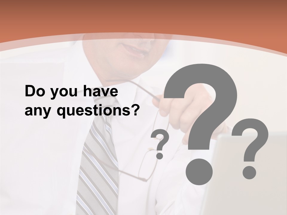 A Man In A Tie Is Looking At A Laptop PowerPoint Template