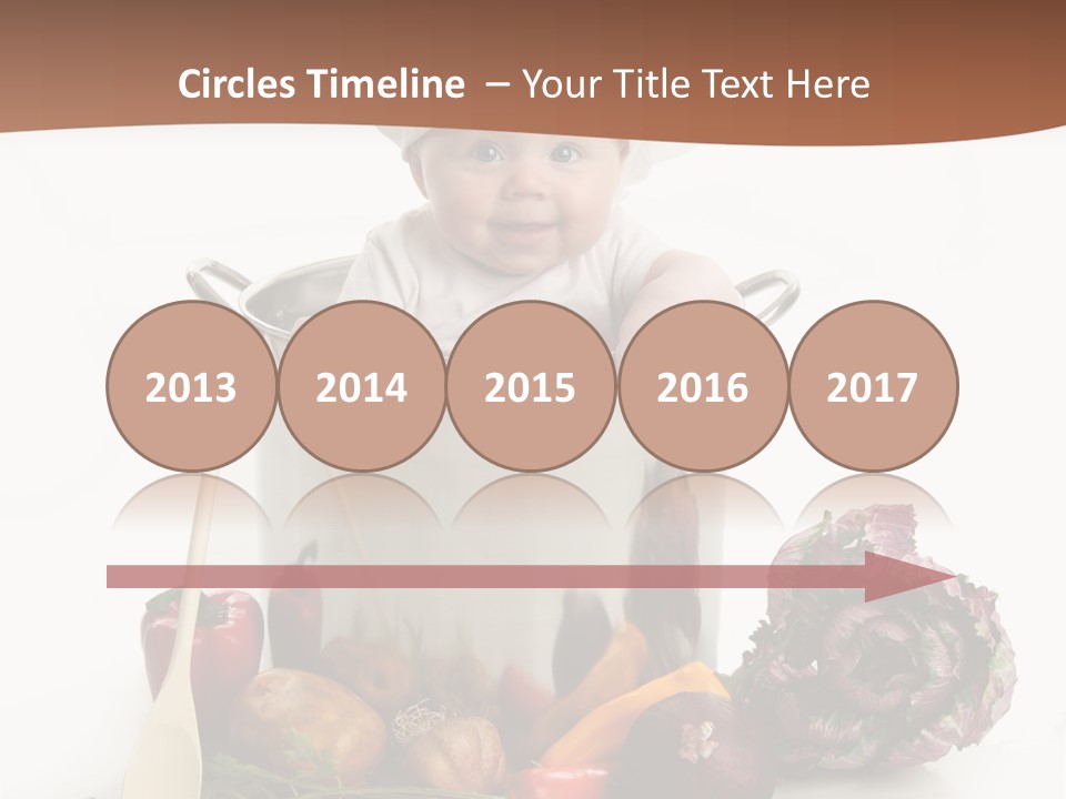 A Baby In A Chef's Hat Sitting In A Bucket Of Vegetables PowerPoint Template