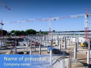 A Construction Site With Lots Of Cranes In The Background PowerPoint Template