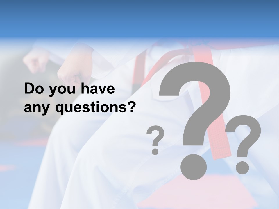 A Person In A Karate Stance With A Red Belt PowerPoint Template