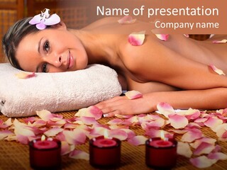 A Beautiful Woman Laying On A Towel Next To Candles PowerPoint Template