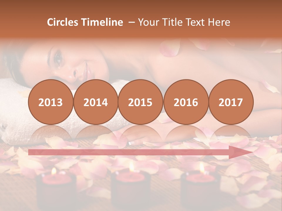 A Beautiful Woman Laying On A Towel Next To Candles PowerPoint Template