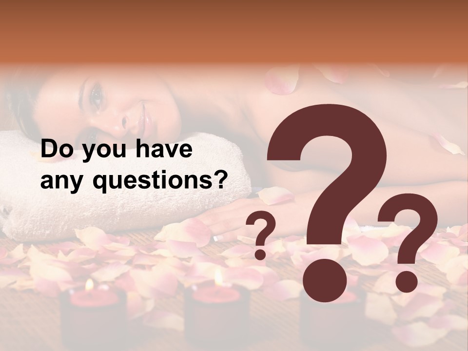 A Beautiful Woman Laying On A Towel Next To Candles PowerPoint Template