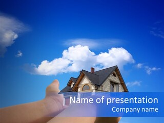 A Person Holding Up A House In Front Of A Blue Sky PowerPoint Template