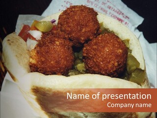 A Taco Filled With Meatballs On Top Of A Wrapper PowerPoint Template