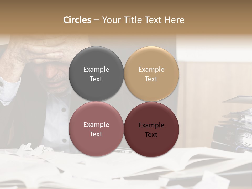 A Man Sitting At A Desk With A Pile Of Papers In Front Of Him PowerPoint Template