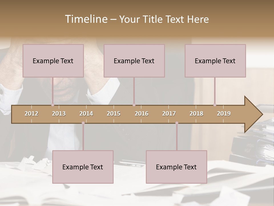 A Man Sitting At A Desk With A Pile Of Papers In Front Of Him PowerPoint Template
