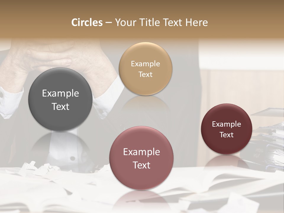 A Man Sitting At A Desk With A Pile Of Papers In Front Of Him PowerPoint Template