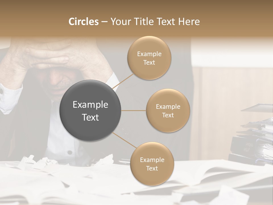 A Man Sitting At A Desk With A Pile Of Papers In Front Of Him PowerPoint Template