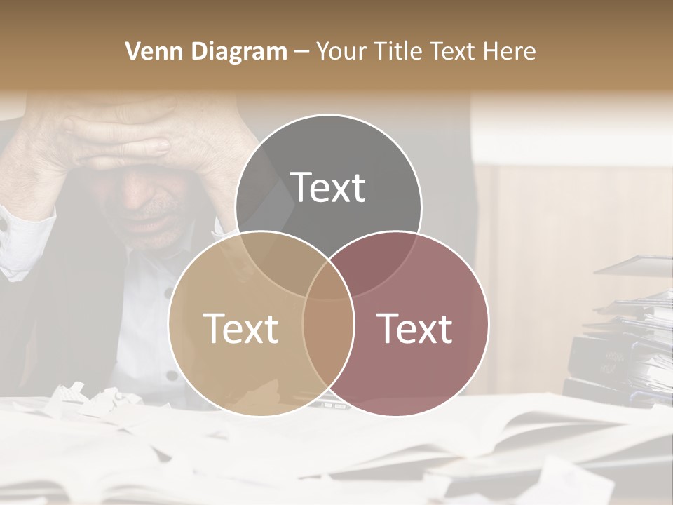 A Man Sitting At A Desk With A Pile Of Papers In Front Of Him PowerPoint Template