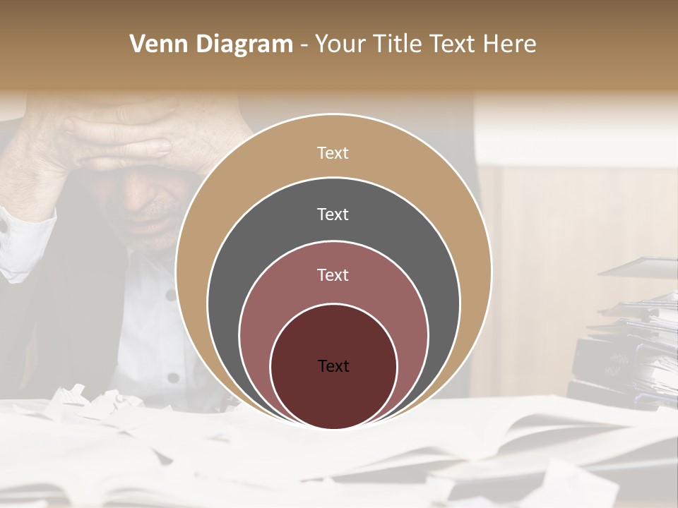 A Man Sitting At A Desk With A Pile Of Papers In Front Of Him PowerPoint Template