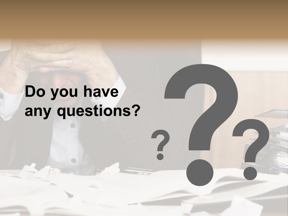 A Man Sitting At A Desk With A Pile Of Papers In Front Of Him PowerPoint Template