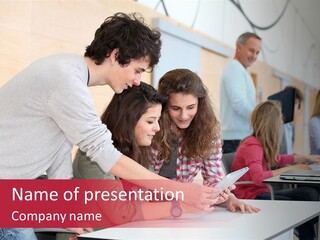 A Group Of Young People Looking At A Computer Screen PowerPoint Template