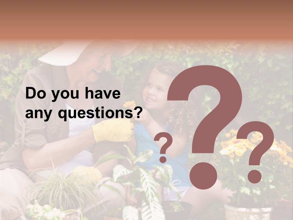 A Woman And A Little Girl Sitting In A Garden PowerPoint Template