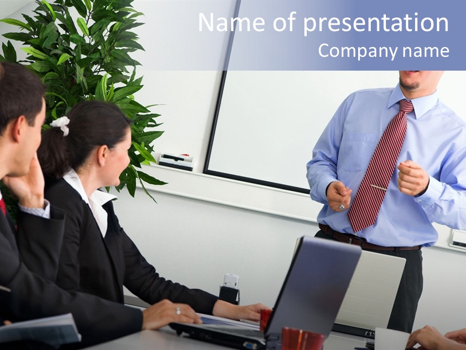A Man Giving A Presentation To A Group Of People PowerPoint Template