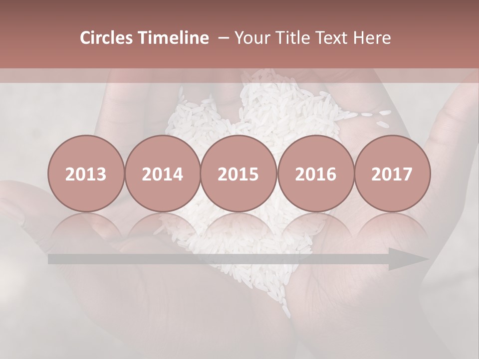 A Person Holding A Pile Of Rice In Their Hands PowerPoint Template