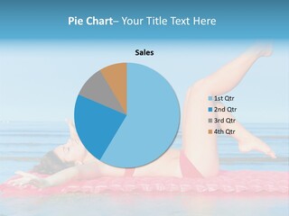 A Woman In A Red Bikini Laying On The Beach PowerPoint Template