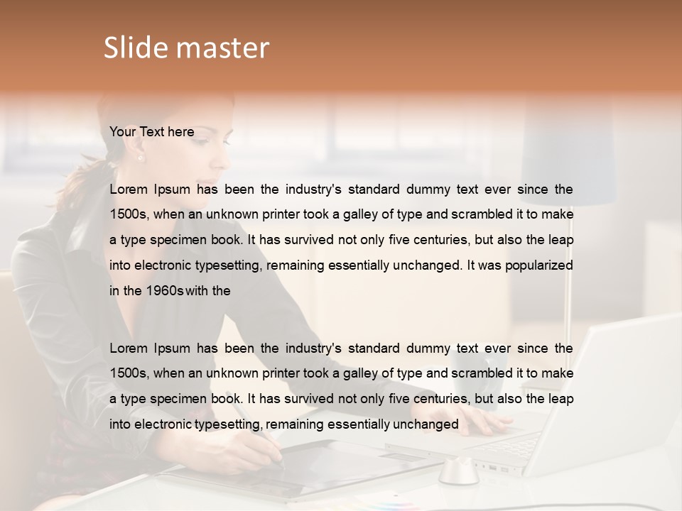 A Woman Sitting At A Desk Using A Laptop Computer PowerPoint Template