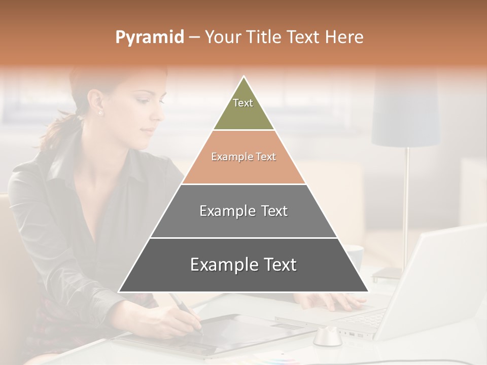 A Woman Sitting At A Desk Using A Laptop Computer PowerPoint Template