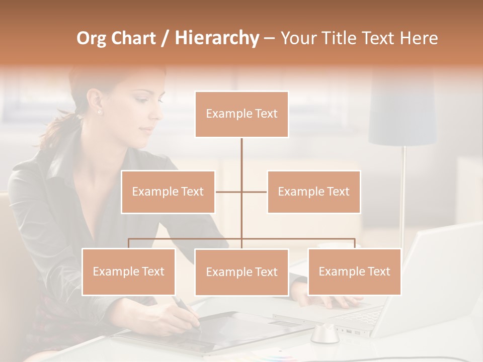 A Woman Sitting At A Desk Using A Laptop Computer PowerPoint Template