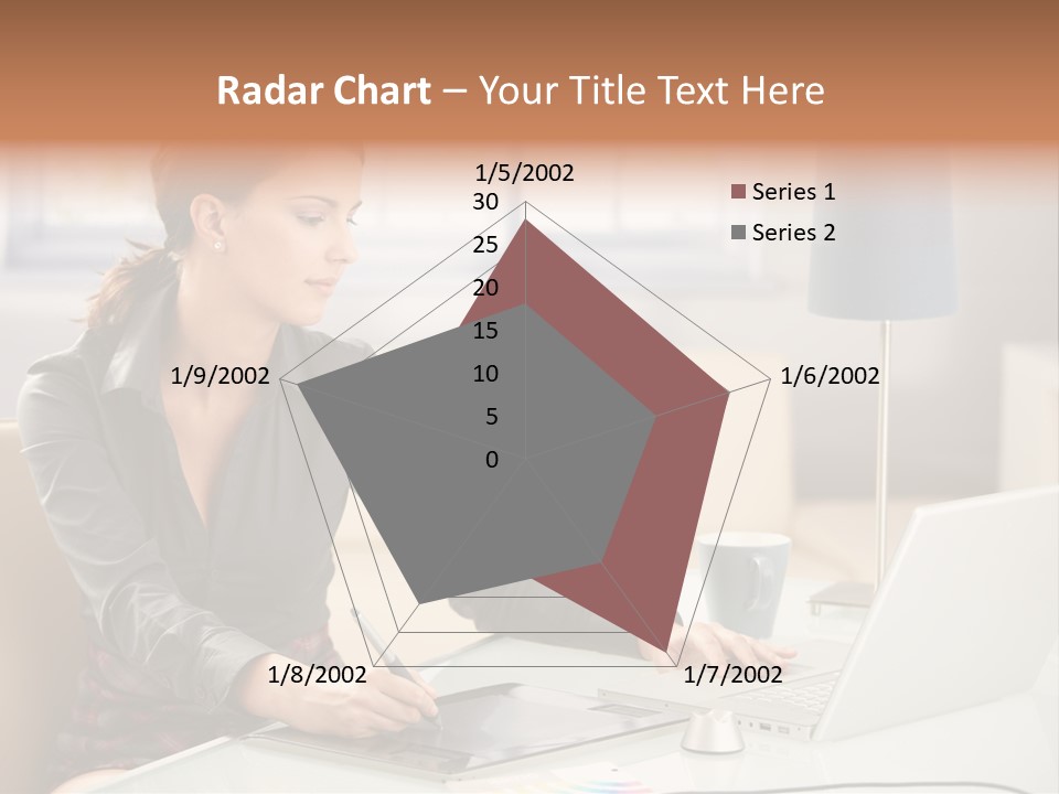 A Woman Sitting At A Desk Using A Laptop Computer PowerPoint Template