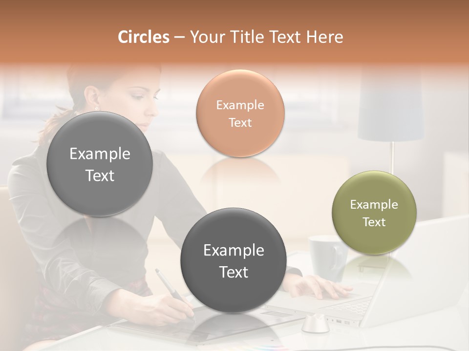 A Woman Sitting At A Desk Using A Laptop Computer PowerPoint Template