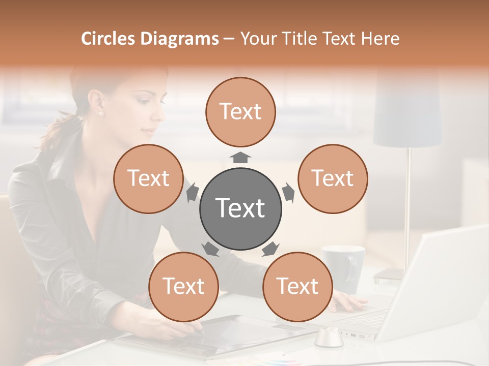 A Woman Sitting At A Desk Using A Laptop Computer PowerPoint Template