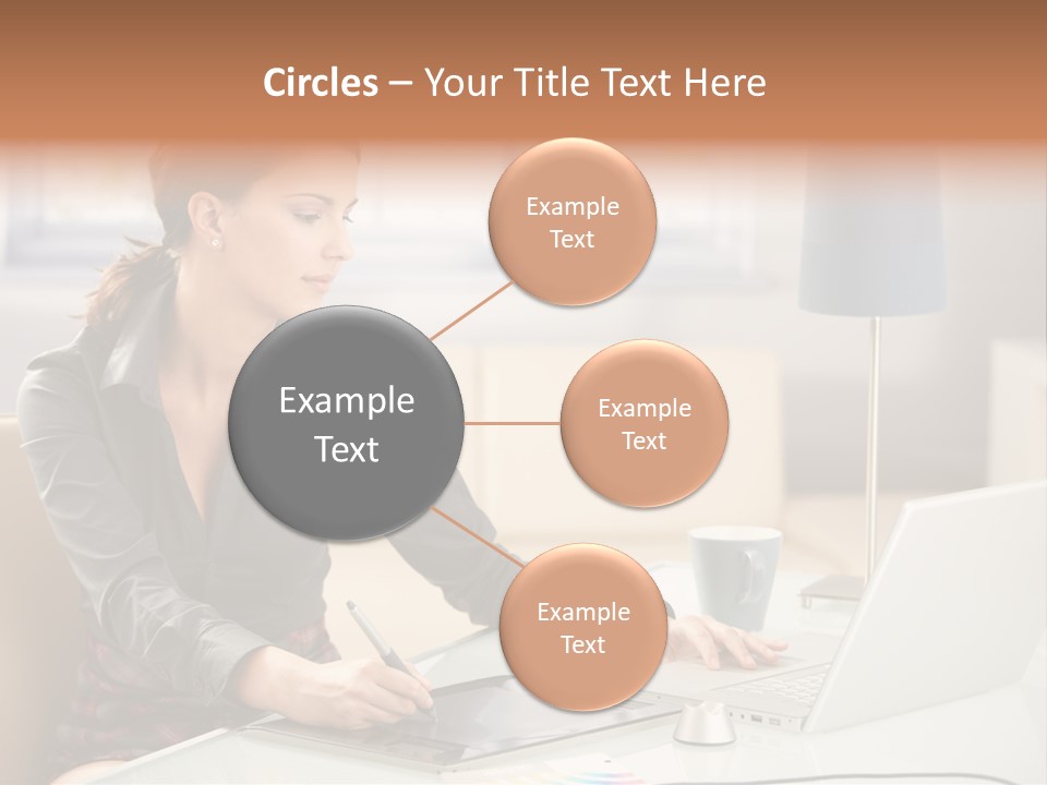 A Woman Sitting At A Desk Using A Laptop Computer PowerPoint Template