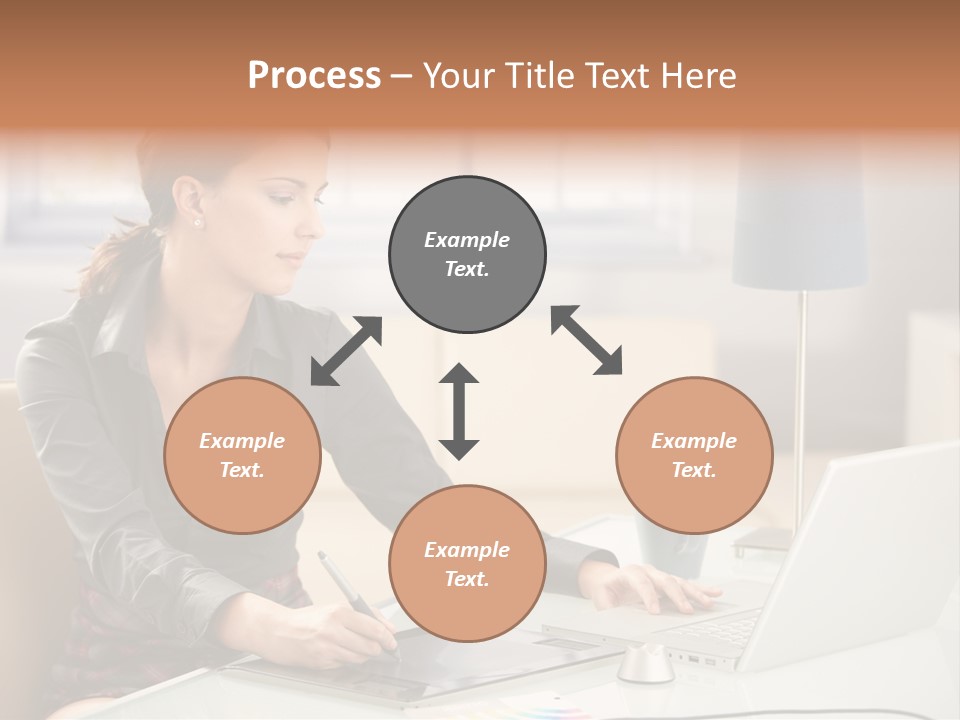 A Woman Sitting At A Desk Using A Laptop Computer PowerPoint Template
