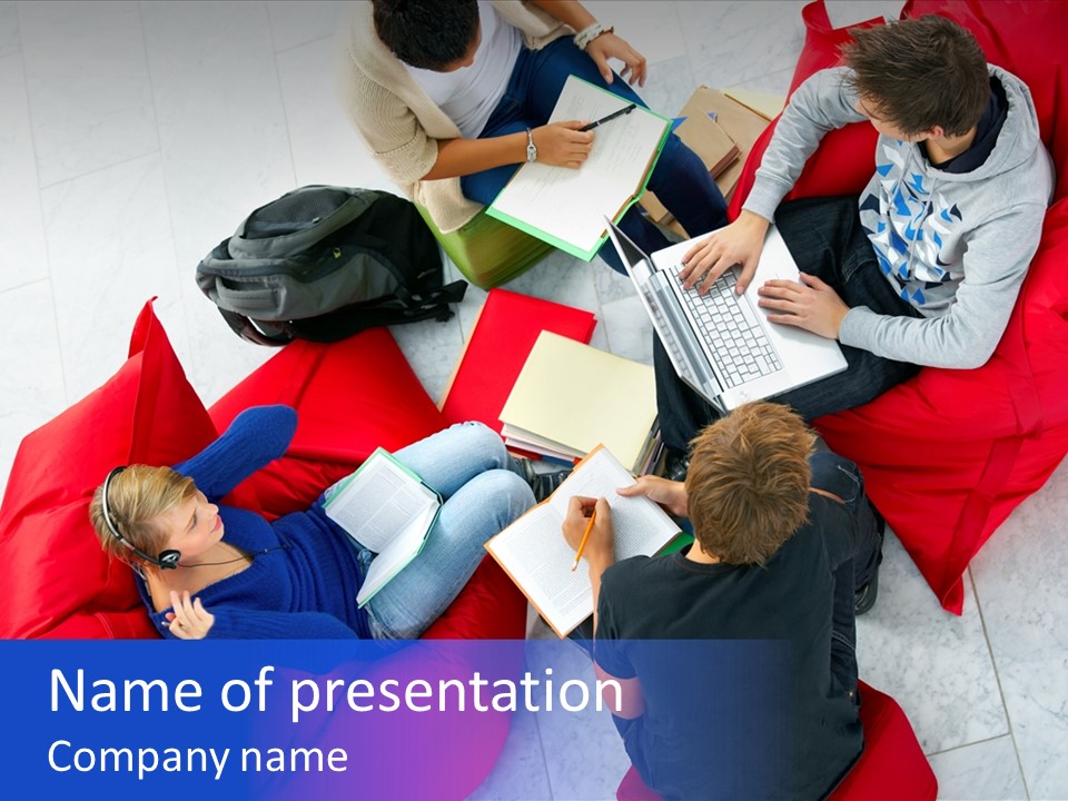 A Group Of People Sitting On Bean Bag Chairs Working On Laptops PowerPoint Template