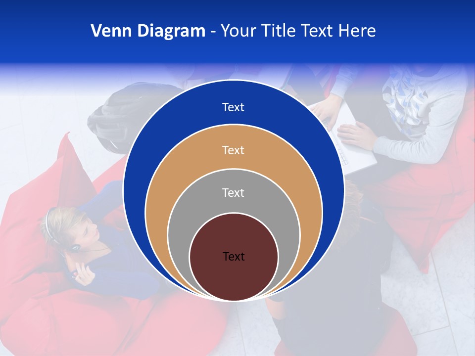 A Group Of People Sitting On Bean Bag Chairs Working On Laptops PowerPoint Template